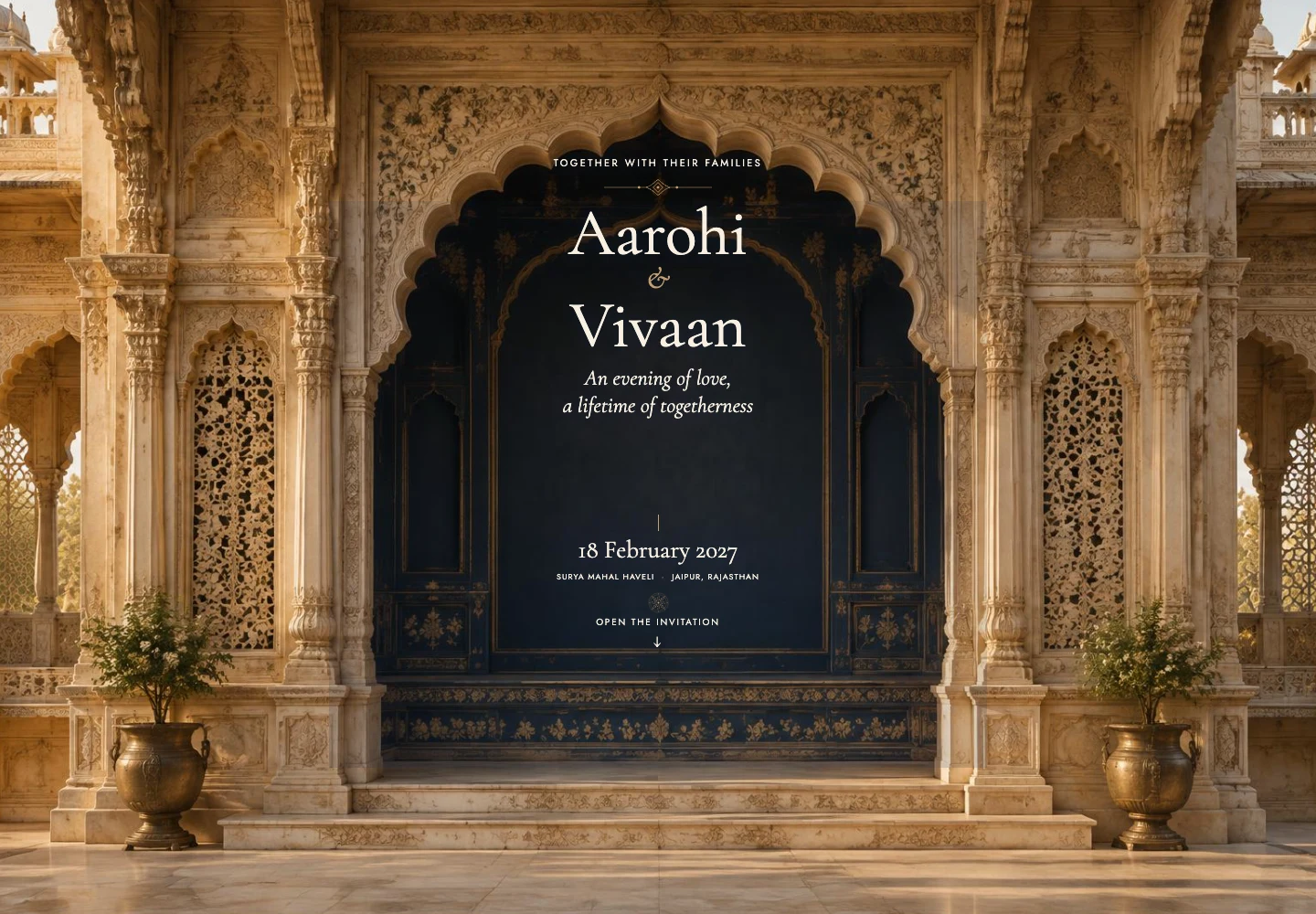 Jharokha invitation: warm sandstone architecture and the couple’s names.
